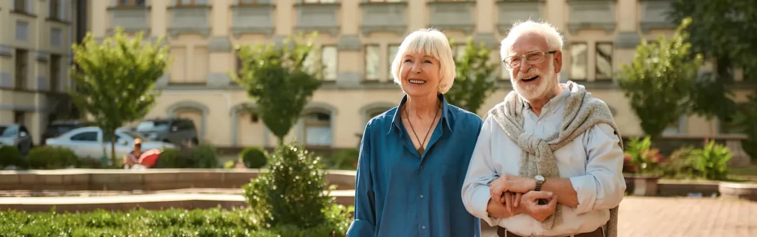 Elderly couple walking outdoors together